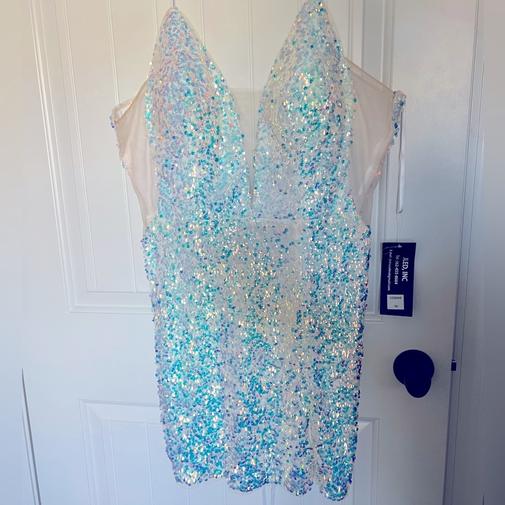 Never worn, white, sparkly mini dress. Opal iridescent, with white tie back.